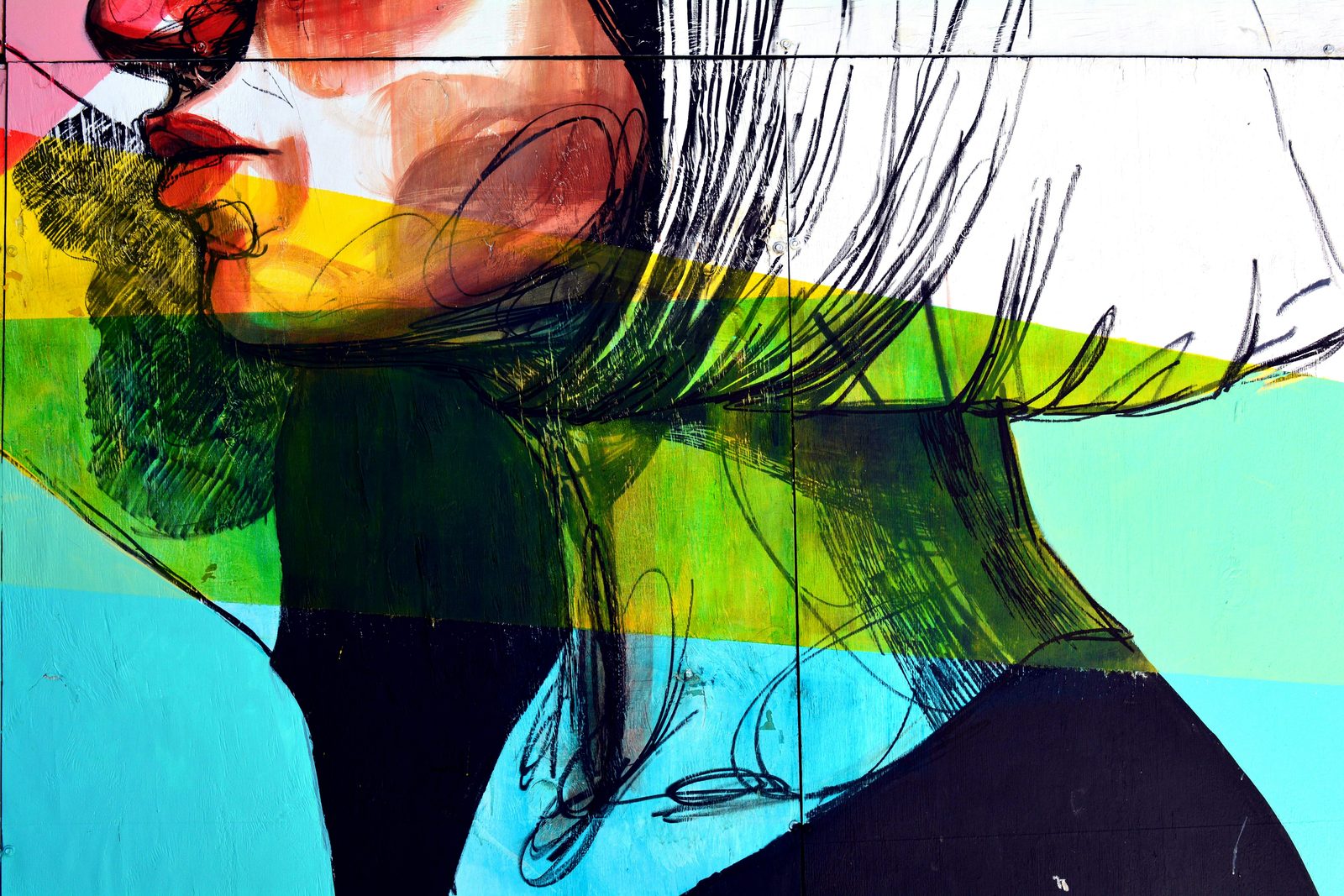 Painted mural of a woman's face in profile