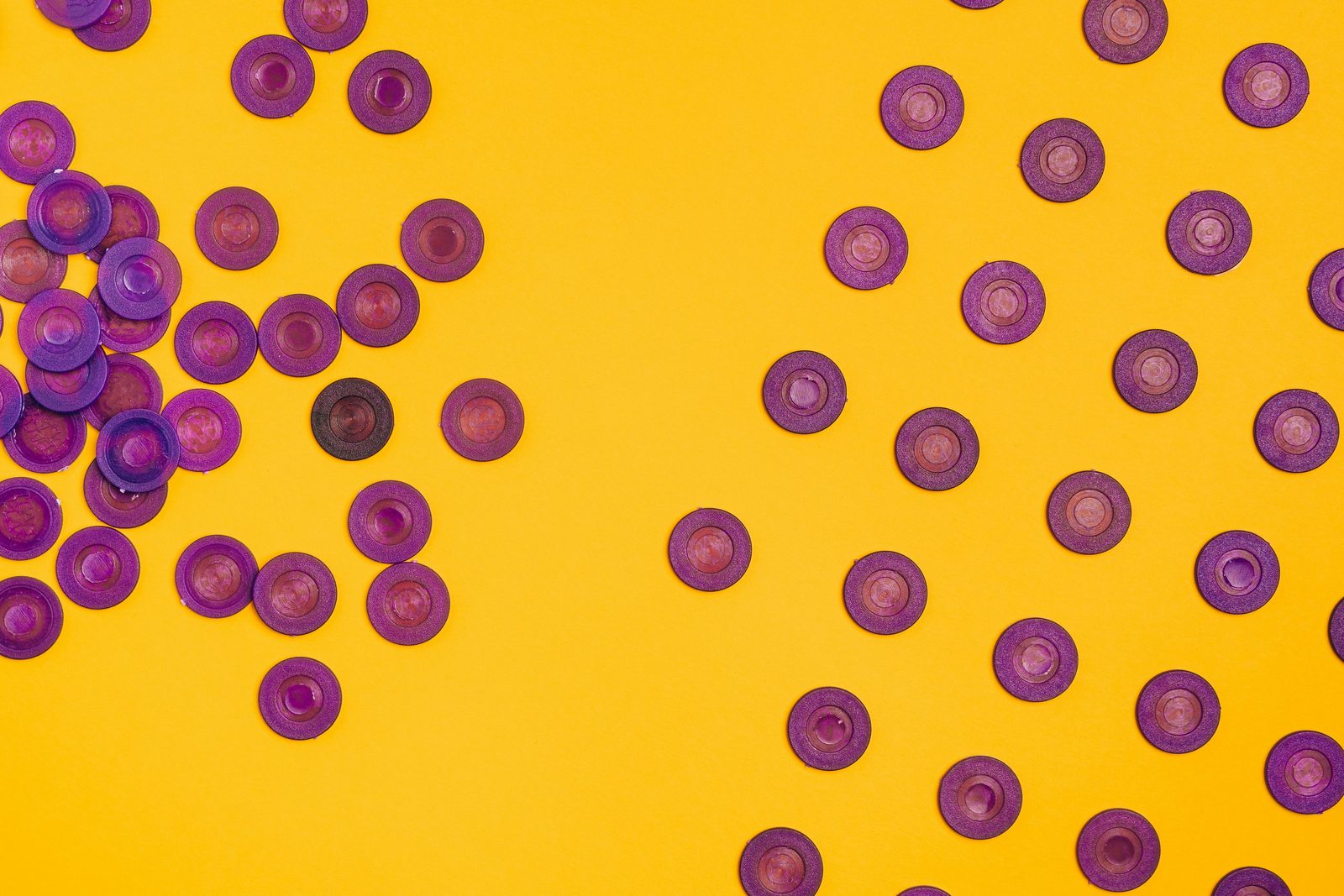 Purple discs scattered across a yellow background