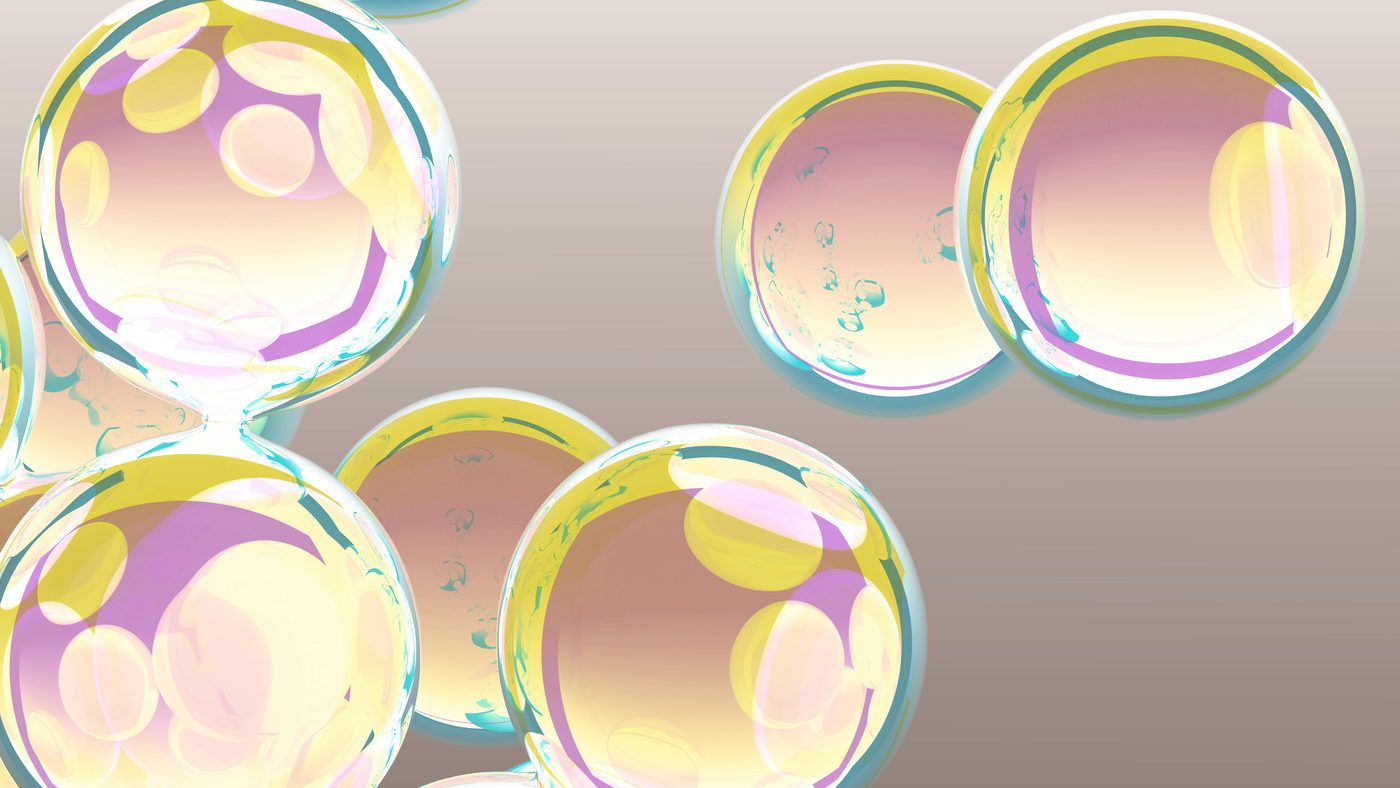 Iridescent translucent spheres on a pale background